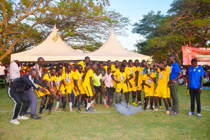 COIN 10 Champions Reru FC lifting their trophy with Raila Odinga Junior